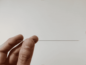 Sterile single-use dry needling needle used by Gold Coast physiotherapist Lucus Leung
